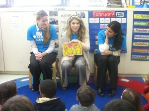 Volunteers from Barclays Capital read to kids at New York City’s Gramercy School at a First Book event