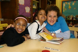 Barclays volunteers and First Book staff with students at Girls Prep Bronx Elementary School, New York, May 14